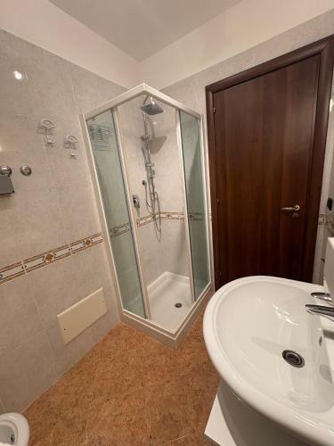 a bathroom with a shower and a sink at Onepta Retreat in Reggio Calabria
