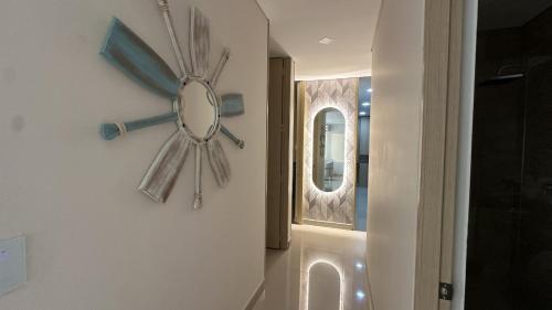 a bathroom with a mirror on the wall at Reserva Del Mar Apartamentos in Gaira