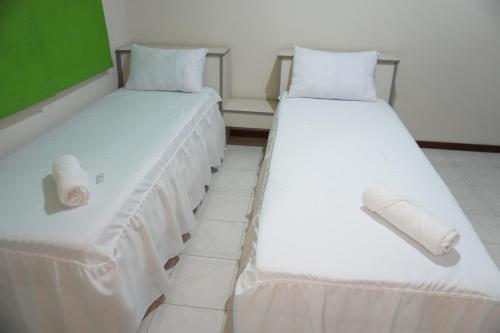 Giường trong phòng chung tại Hotel Minarini