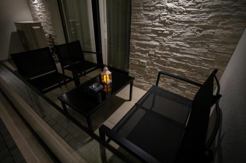 a living room with two chairs and a table at Villa Klaus Center Hotel in Tirana