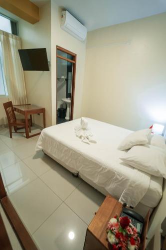 Postel nebo postele na pokoji v ubytování Hotel Suisui