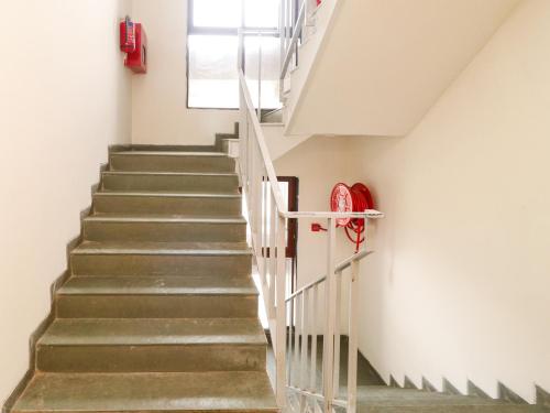 a staircase in a building with a window at Hotel Tattva Suites in Pune