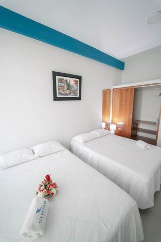Postel nebo postele na pokoji v ubytování Hotel Suisui
