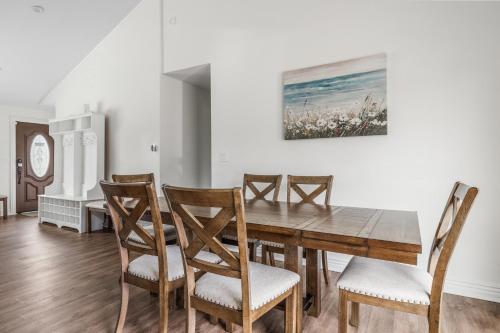 a dining room with a wooden table and chairs at Rocky Gap Getaway in Benton Harbor