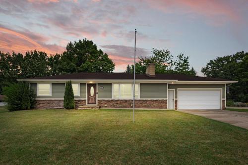a house with a driveway and a garage at Rocky Gap Getaway in Benton Harbor