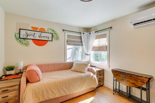 a living room with a couch and a window at Walkable and Bright Bungalow in Dtwn Redding! in Redding