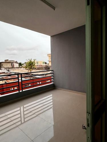 a room with a balcony with a view at Private Room With Balcony, External Bathroom in Cotonou