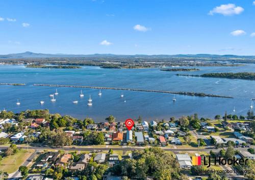an aerial view of a harbor with boats in the water at Sandy Feet in Iluka
