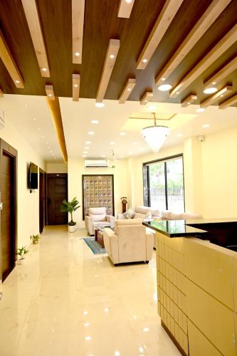 a living room with a couch and a table at JMD Royal Residency I Luxury 3-Star Hotel in Varanasi