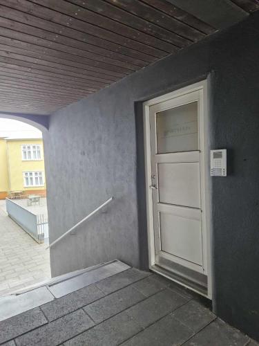 a door in the side of a building at Vesturgata in Reykjavík