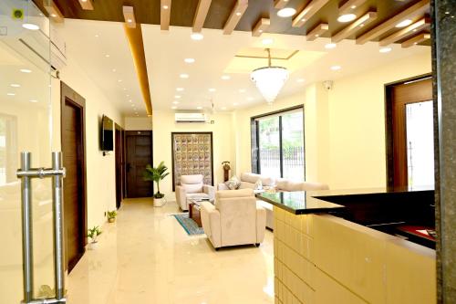 a living room with a couch and a table at JMD Royal Residency I Luxury 3-Star Hotel in Varanasi