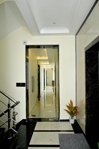 a hallway with a mirror in a building at JMD Royal Residency I Luxury 3-Star Hotel in Varanasi