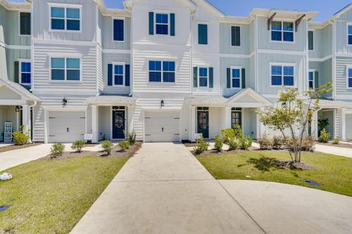 a large white apartment building with a driveway at 2 Mi to Ocean Townhome with Pool and Dog Park in PCB! in Panama City Beach