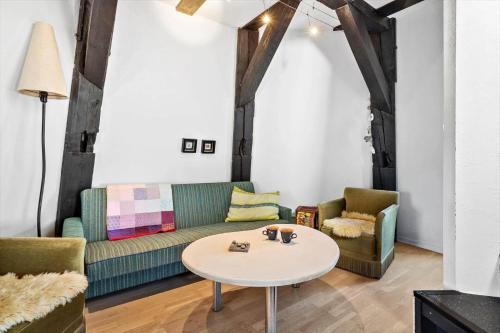 a living room with a couch and a table at 1060-Thisted-Rodals-Bakke-21 in Torsted