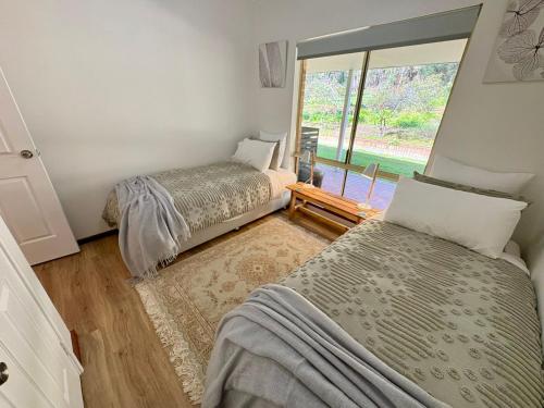 Ένα ή περισσότερα κρεβάτια σε δωμάτιο στο Chalwell Lodge