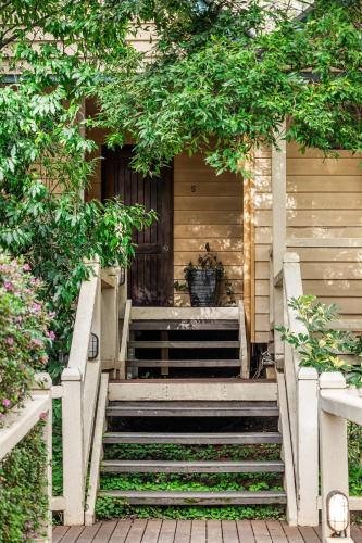 a stairway leading up to a house with a plant at Heritage Trail Lodge in Margaret River Town