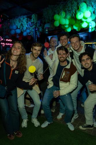 a group of people posing for a picture at a party at Wild Rover Huacachina in Ica