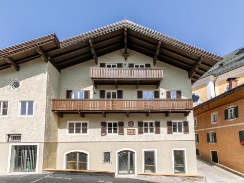 a building with a balcony on top of it at Hopfgarten Alpin Living Top 2 in Hopfgarten im Brixental