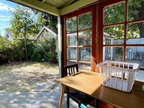 a table with a basket on it on a porch at Pasadena Quiet Gem with Fiber Internet WiFi and Workspace in Pasadena