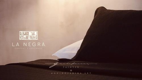 a bed with a pillow on top of it at Alojamiento las americas in Mérida
