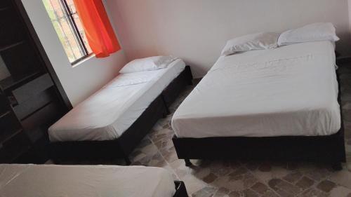 Ένα ή περισσότερα κρεβάτια σε δωμάτιο στο Hotel terrazas del sol