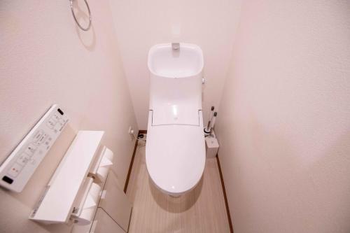 a bathroom with a toilet in a small room at Blue Marina Yokosuka - 7-minute walk from Yokosuka Chuo station, 2-4pax in Yokosuka