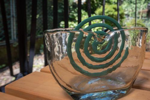 a glass vase sitting on top of a table at Private Lodge 春夏秋冬 -SHIKI- in Shibukawa