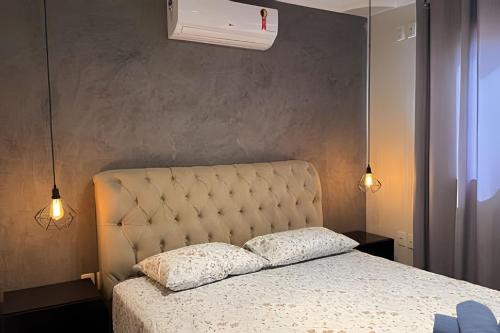 Ένα ή περισσότερα κρεβάτια σε δωμάτιο στο Espaçosa casa próxima ao Centro