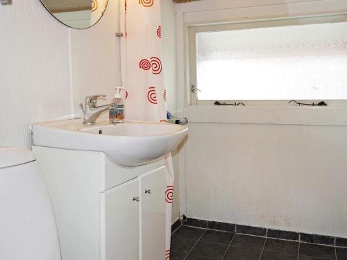 a bathroom with a sink and a window at 6 person holiday home in Storvorde-By Traum in Storvorde