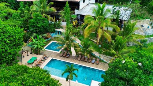 an aerial view of a resort with a swimming pool at Greengos Hotel in Lanquín