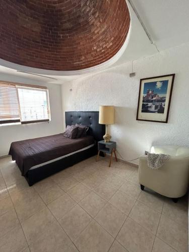 Postel nebo postele na pokoji v ubytování Casa a pie de los arcos con tiendas y restaurants