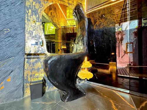 a statue of a bird on the floor of a building at Luxury Cabin Eleven Eleven in San Rafael