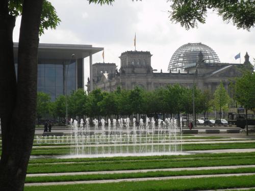 a water fountain in front of a building at Hotel Carolinenhof in Berlin