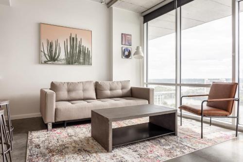 a living room with a couch and a table at Kasa 2Nd Street Austin in Austin