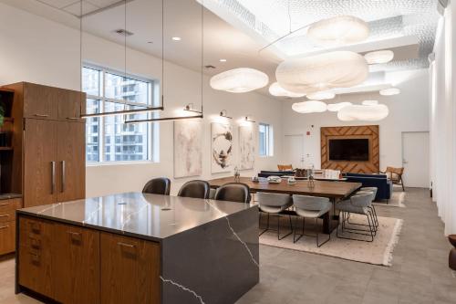 a kitchen and dining room with a table and chairs at Kasa 2Nd Street Austin in Austin
