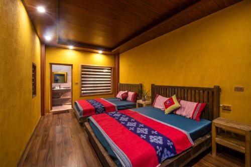 Postel nebo postele na pokoji v ubytování Khói Bản Homestay