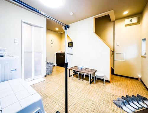 a room with a table and a dining room at 惠美屋 东 in Osaka