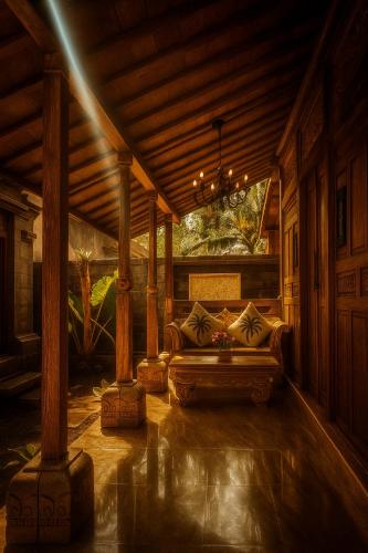 Ruang duduk di Pradnya Villa by Prasi