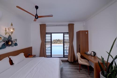 Ένα ή περισσότερα κρεβάτια σε δωμάτιο στο Bougainvillea Beach Home - Guruvayur - Chavakkad
