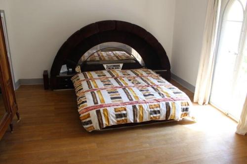 a bedroom with a bed in front of a fireplace at Chateau Castelrives in Bessières