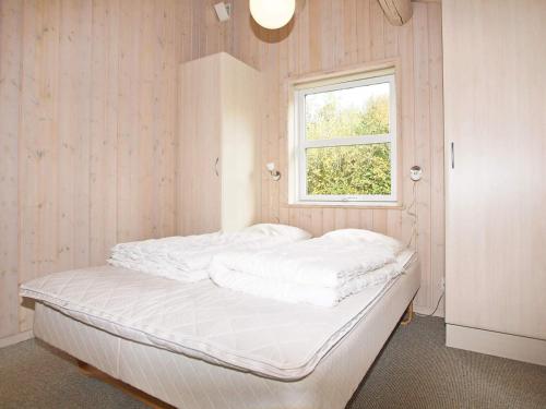 Ένα ή περισσότερα κρεβάτια σε δωμάτιο στο Modern Cottage with Spa - By Traum Ferienwohnungen