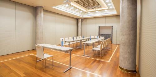 a conference room with tables and chairs in it at NH Collection Vigo in Vigo