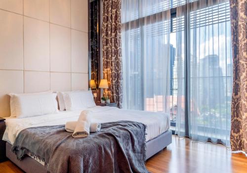 Ένα ή περισσότερα κρεβάτια σε δωμάτιο στο Dorsett Bukit Bintang near Pavilion KL, Kuala Lumpur