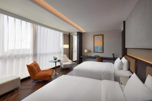 Jin Jiang International Hotel Mianyangにあるベッド
