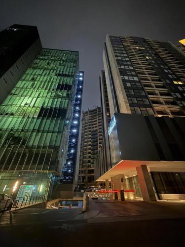 two tall buildings in a city at night at The Park Toreo 407 in Tijuana