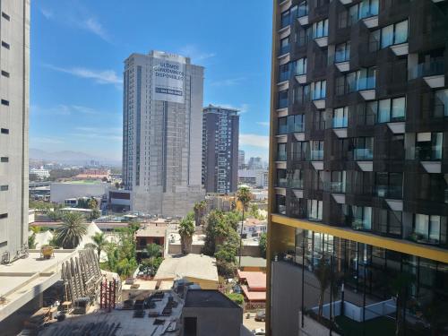 una vista de una ciudad con edificios altos en In the financial district Tijuana 664 Aparthotel, en Tijuana
