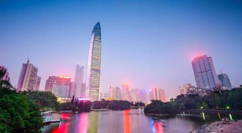 a city skyline with a river and a tall building at ZMAX Hotels Shenzhen Lianhuacun Metro Station in Shenzhen