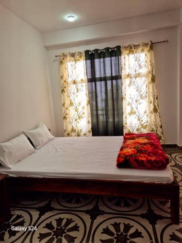 Postel nebo postele na pokoji v ubytování Bagalay Homestay Mungpoo