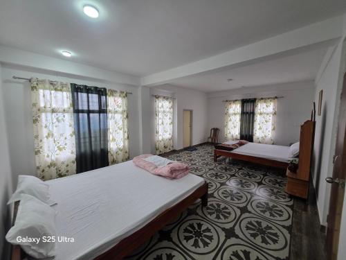 Postel nebo postele na pokoji v ubytování Bagalay Homestay Mungpoo