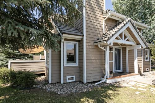 a tiny house with a porch and a window at 470 Homestead Unit 13 townhouse in Edwards